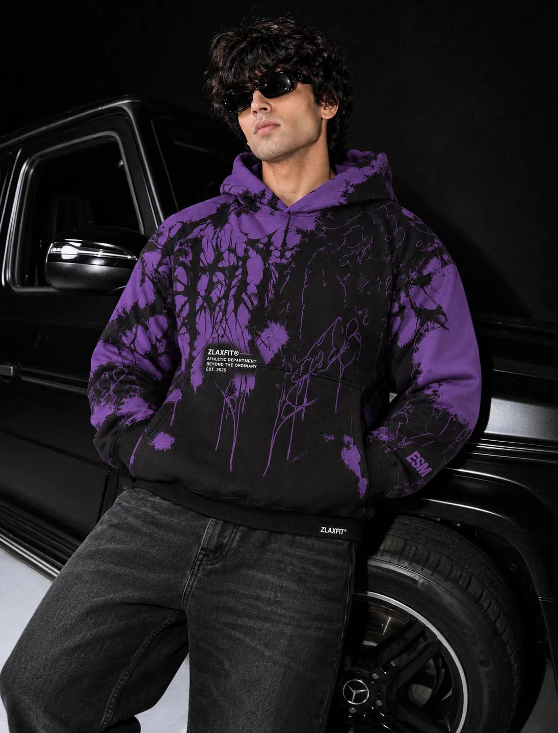 Sleeve and shoulder graphics on the purple and black Zlaxfit hoodie
