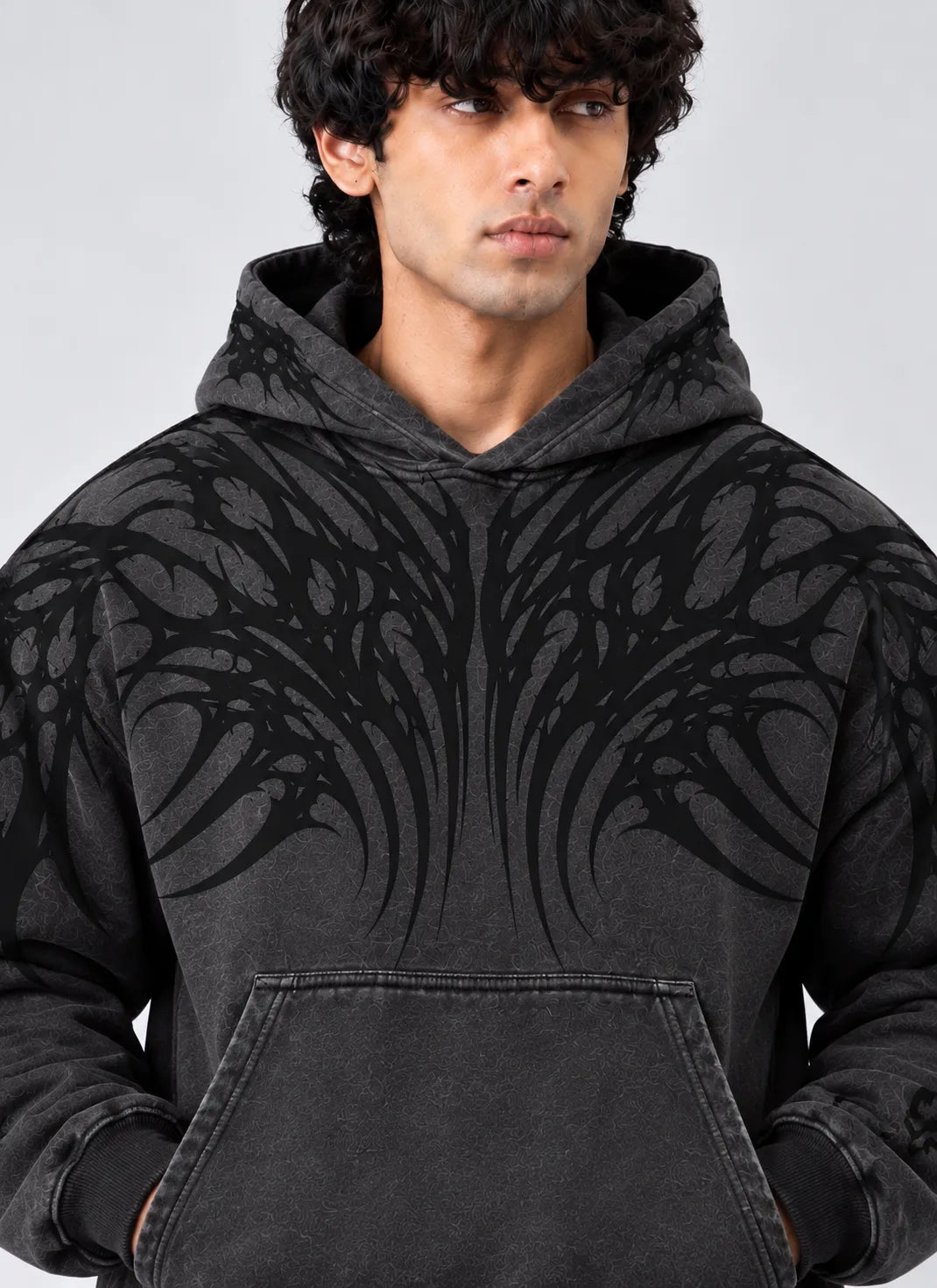 Men's charcoal streetwear hoodie with a dark abstract graphic design