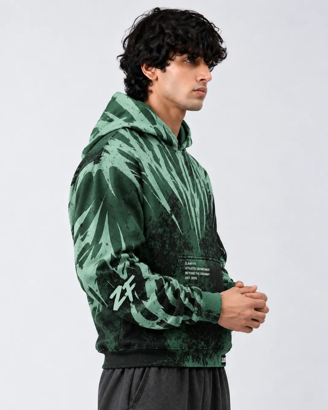Front view of the Zlaxfit Toxic Reign Hoodie in green and black
